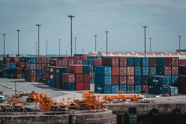 shipping containers stacked on top of one another