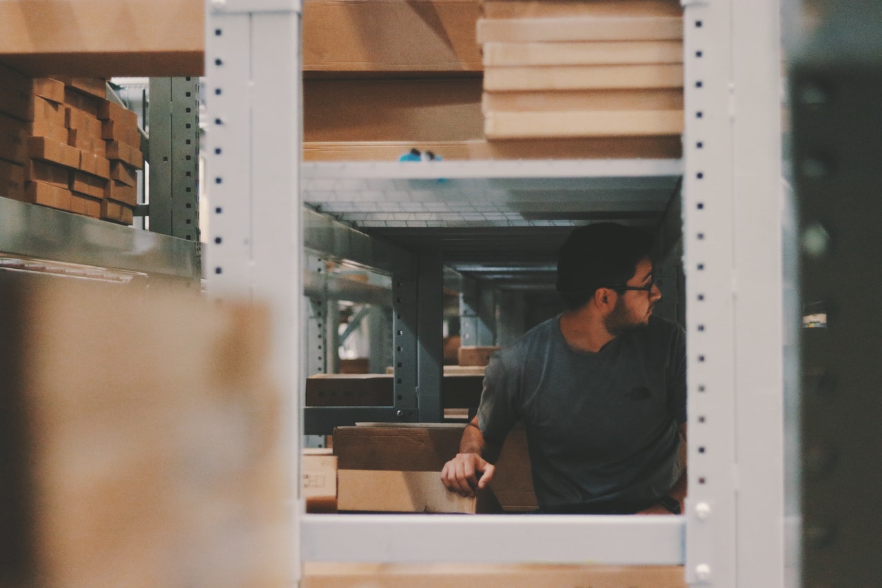 man checking order in warehouse