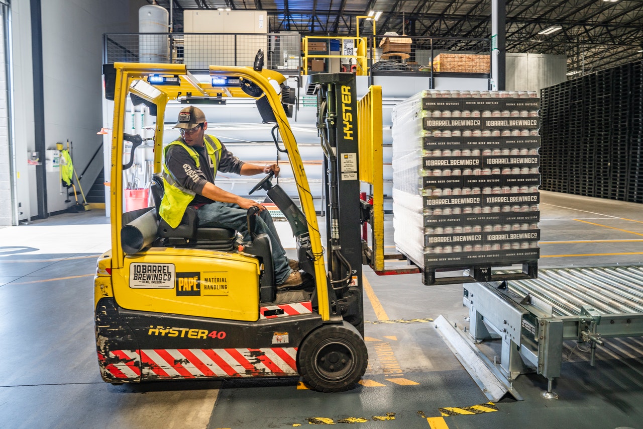 man operating warehouse forklift