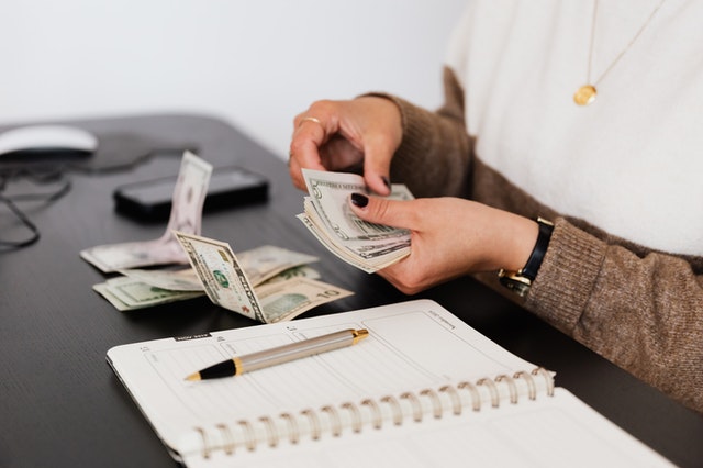 woman counting bills